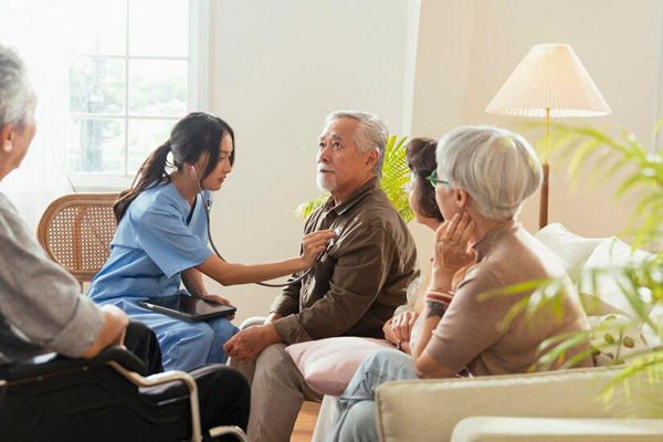 Caregiver Checking Older Mans Heart